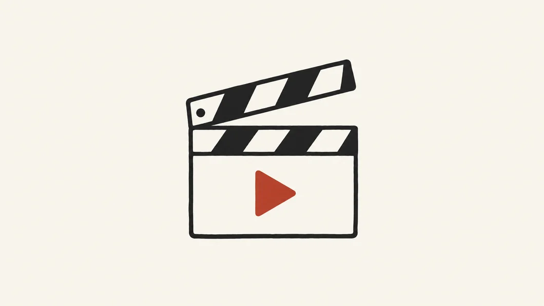 Ink clapperboard with a rust play triangle